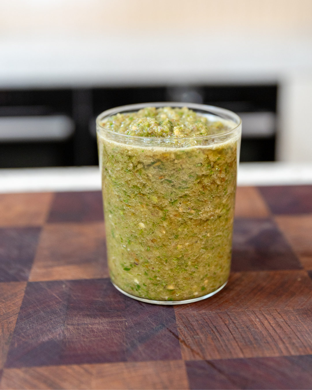 Green salsa verde made with green tomatoes, jalapeños, lime, and coriander.