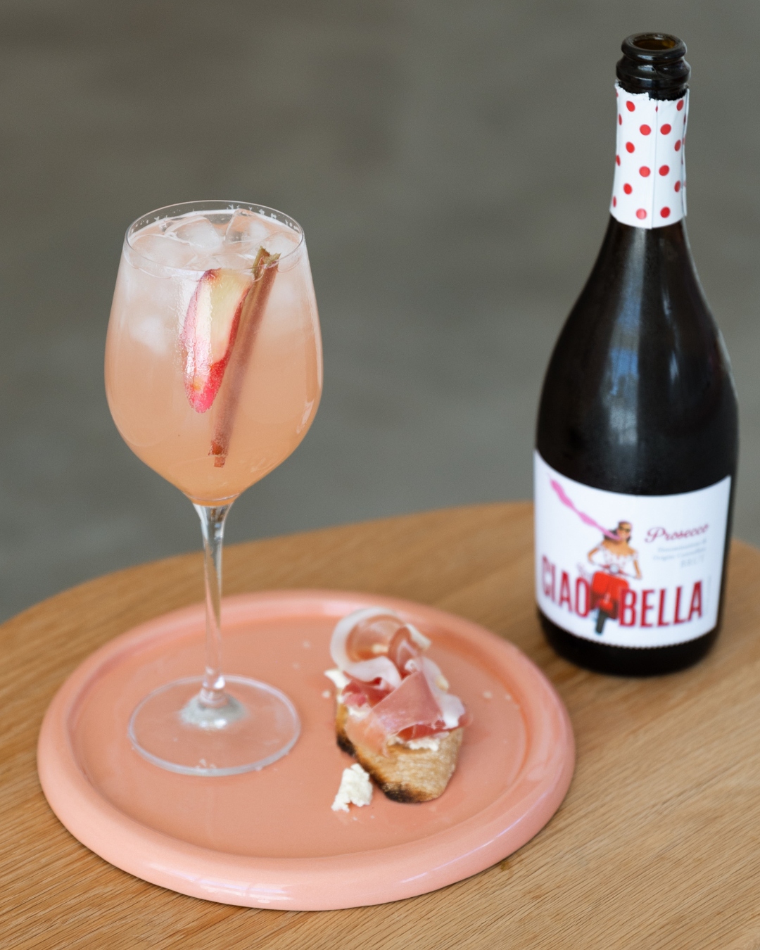 Rhubarb Cocktail and Crostini with prosciutto, stracciatella, and rhubarb syrup
